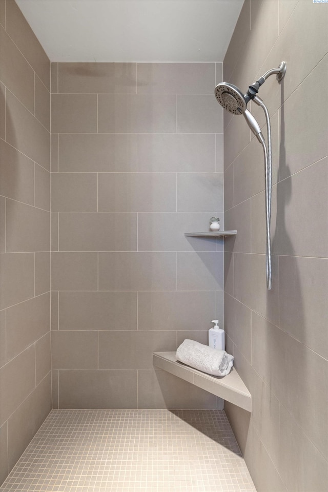 bathroom with a tile shower