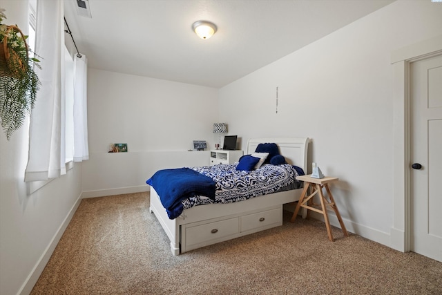 bedroom featuring light colored carpet