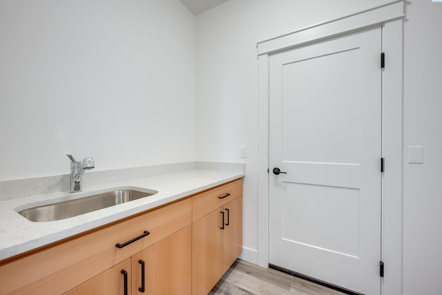 1060 SW Panorama Dr, Pullman, WA 99163 - washroom featuring a sink and light wood finished floors