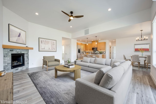 1060 SW Panorama Dr, Pullman, WA 99163 - living area featuring visible vents, a fireplace, recessed lighting, light wood finished floors, and ceiling fan with notable chandelier