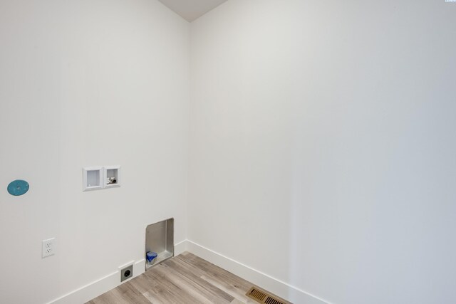 1060 SW Panorama Dr, Pullman, WA 99163 - washroom with laundry area, light wood finished floors, hookup for a washing machine, baseboards, and electric dryer hookup