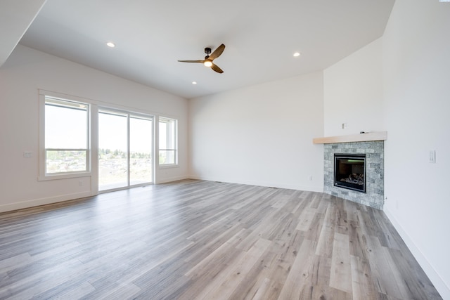 1060 SW Panorama Dr, Pullman, WA 99163 - unfurnished living room with a glass covered fireplace, light wood-style floors, baseboards, recessed lighting, and a ceiling fan