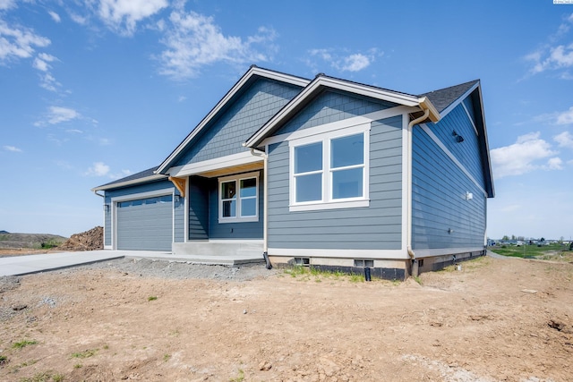 1060 SW Panorama Dr, Pullman, WA 99163 - view of front facade featuring driveway and a garage
