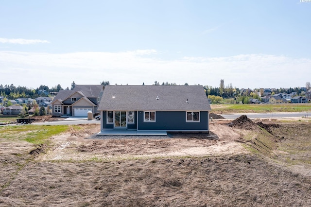 1060 SW Panorama Dr, Pullman, WA 99163 - back of property featuring a residential view and a garage