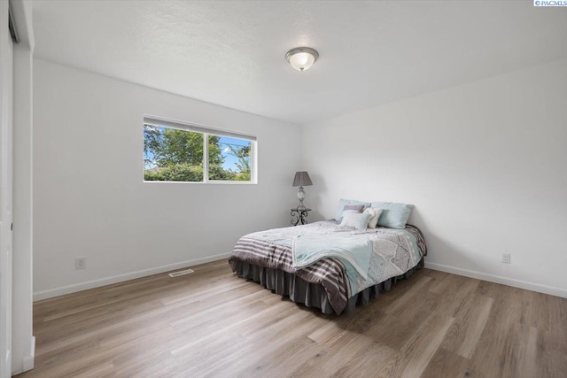 3925 W Okanogan Ave, Kennewick, WA 99336 - bedroom with wood finished floors and baseboards