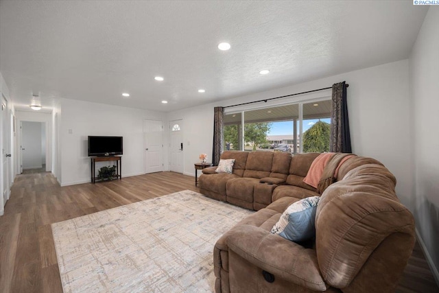 3925 W Okanogan Ave, Kennewick, WA 99336 - living room with wood finished floors, recessed lighting, and baseboards