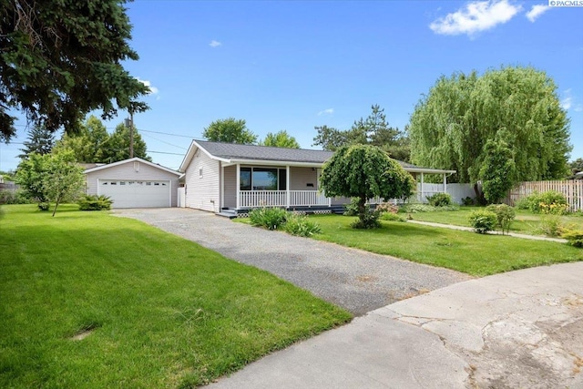 3925 W Okanogan Ave, Kennewick, WA 99336 - ranch-style house with a porch, a detached garage, and an outdoor structure
