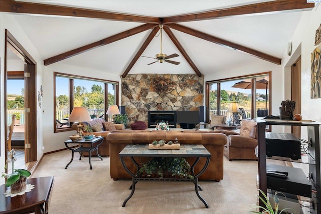 living area featuring light colored carpet, a fireplace, plenty of natural light, and lofted ceiling with beams