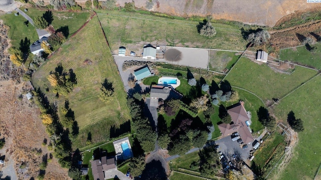 birds eye view of property featuring a rural view