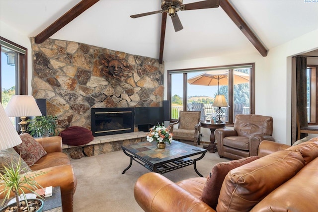 living room featuring vaulted ceiling with beams, carpet flooring, a fireplace, and ceiling fan