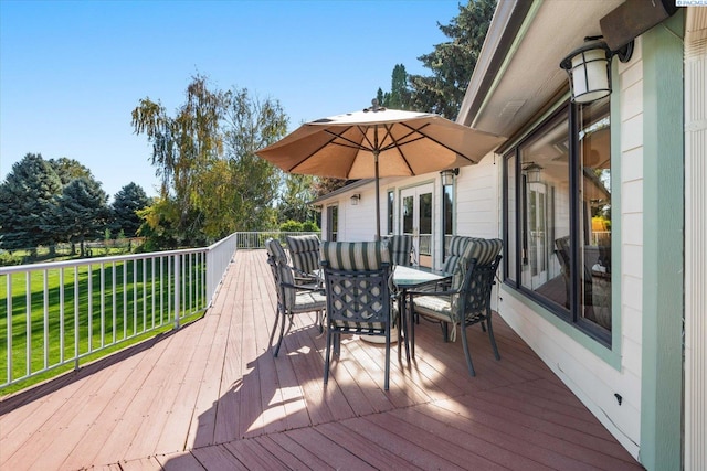 deck with outdoor dining area