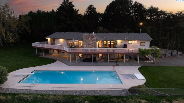 rear view of property with a patio area, stairway, a deck, and a yard