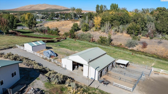 birds eye view of property featuring a rural view and a mountain view