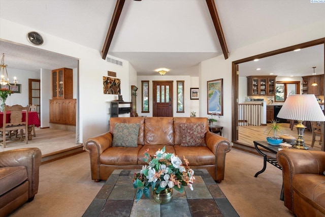 living room with vaulted ceiling with beams, a notable chandelier, carpet floors, visible vents, and plenty of natural light