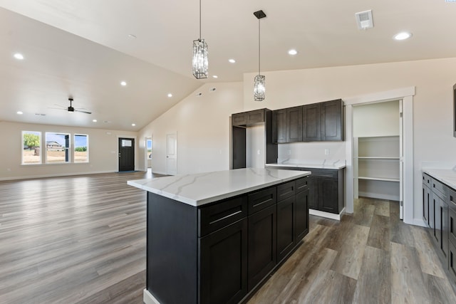 16011 W 1620th Pr NW, Prosser, WA 99350 - kitchen with light wood-style floors, recessed lighting, a ceiling fan, decorative light fixtures, and light stone counters
