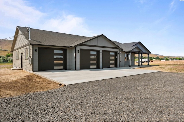 16011 W 1620th Pr NW, Prosser, WA 99350 - view of front of house with a garage, board and batten siding, and driveway