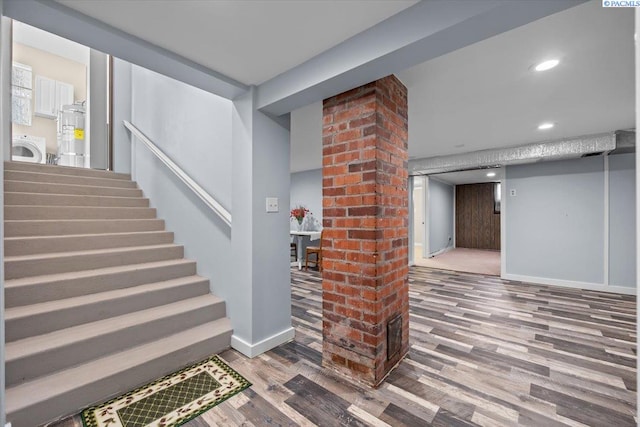 213 Bernard Ave, Richland, WA 99352 - staircase with wood finished floors, washer / dryer, water heater, baseboards, and recessed lighting