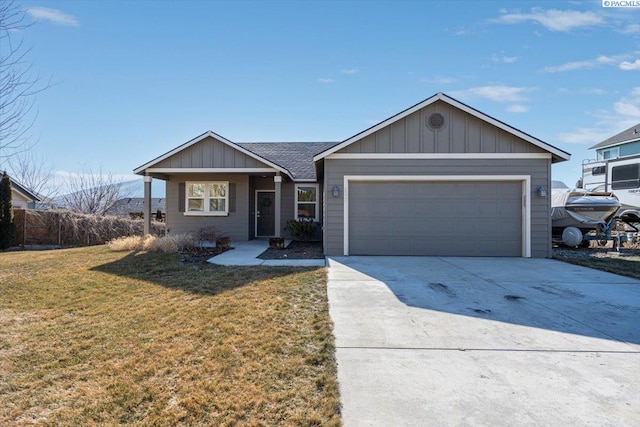 ranch-style home with a garage and a front lawn