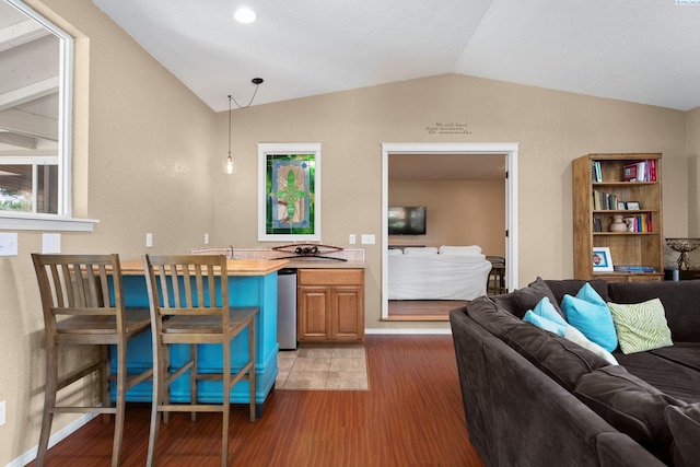 912 Rd 44, Pasco, WA 99301 - living room featuring lofted ceiling and light wood-style flooring