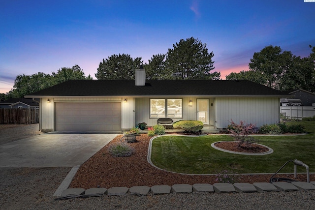 912 Rd 44, Pasco, WA 99301 - ranch-style home with an attached garage, concrete driveway, and a chimney