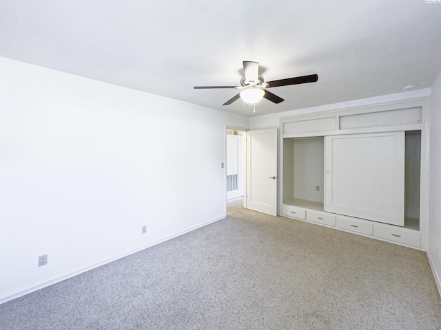 1015 Catherine St, Walla Walla, WA 99362 - unfurnished bedroom with light carpet, baseboards, a closet, and ceiling fan
