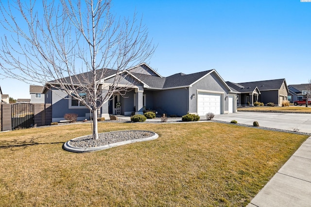 ranch-style house featuring a garage, a front yard, driveway, and stucco siding