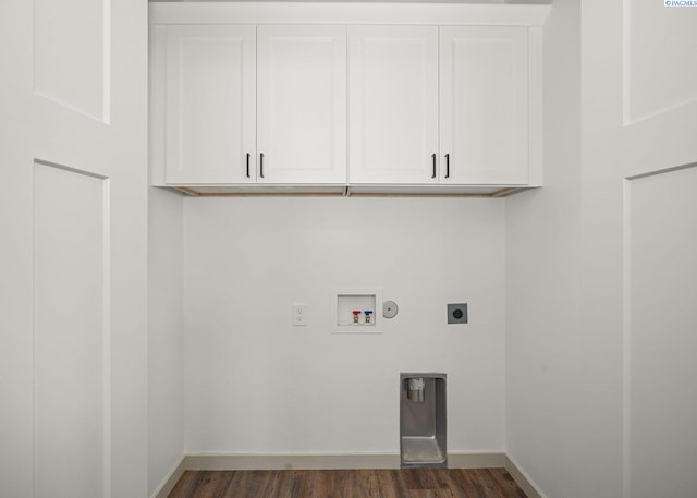 laundry area featuring dark hardwood / wood-style floors, cabinets, hookup for a gas dryer, washer hookup, and hookup for an electric dryer