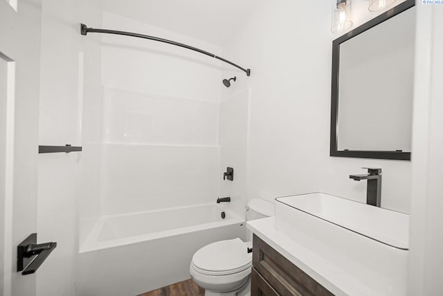 full bathroom featuring vanity, wood-type flooring,  shower combination, and toilet