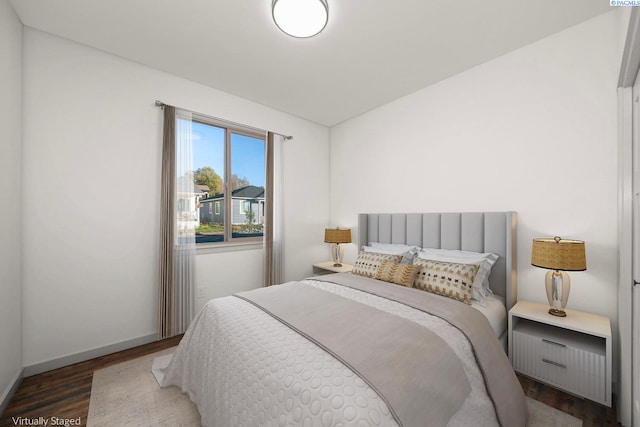 bedroom featuring dark wood-type flooring