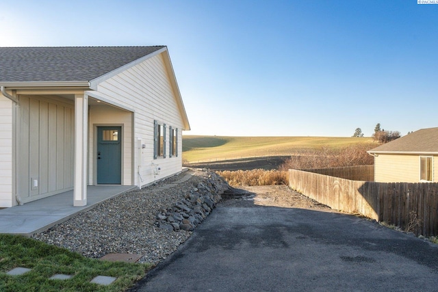 view of property exterior with a patio