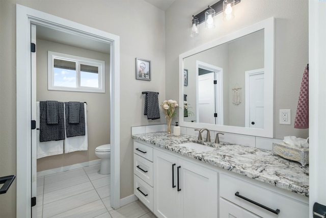 160103 W Byron Rd, Prosser, WA 99350 - bathroom with vanity, tile patterned flooring, toilet, and baseboards