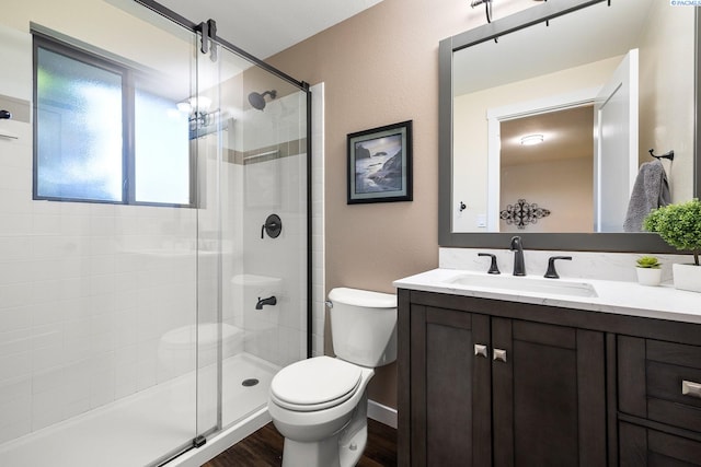 1830 W 23rd Ave, Kennewick, WA 99337 - full bath with a shower stall, toilet, vanity, wood finished floors, and a textured wall