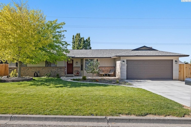 1830 W 23rd Ave, Kennewick, WA 99337 - ranch-style home featuring brick siding, an attached garage, and driveway