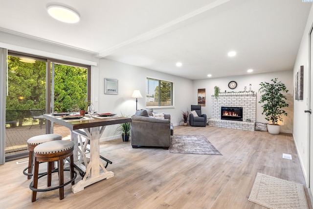 1830 W 23rd Ave, Kennewick, WA 99337 - living room with light wood finished floors, a fireplace, recessed lighting, and baseboards