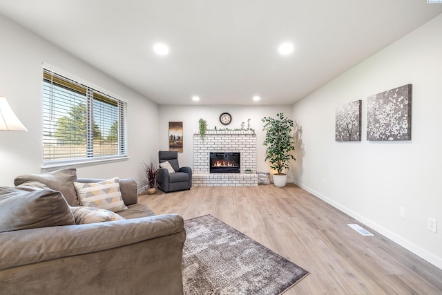 1830 W 23rd Ave, Kennewick, WA 99337 - living area featuring recessed lighting, baseboards, light wood-type flooring, and a brick fireplace