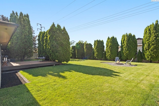 1830 W 23rd Ave, Kennewick, WA 99337 - view of grassy yard featuring an outdoor fire pit and a deck