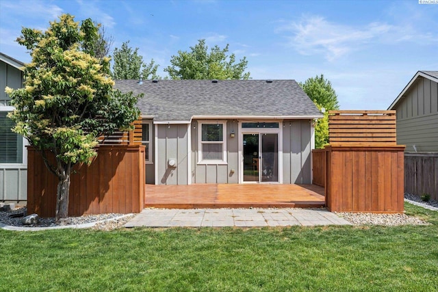 5719 W 15th Ave, Kennewick, WA 99338 - back of property featuring a deck, a shingled roof, and board and batten siding