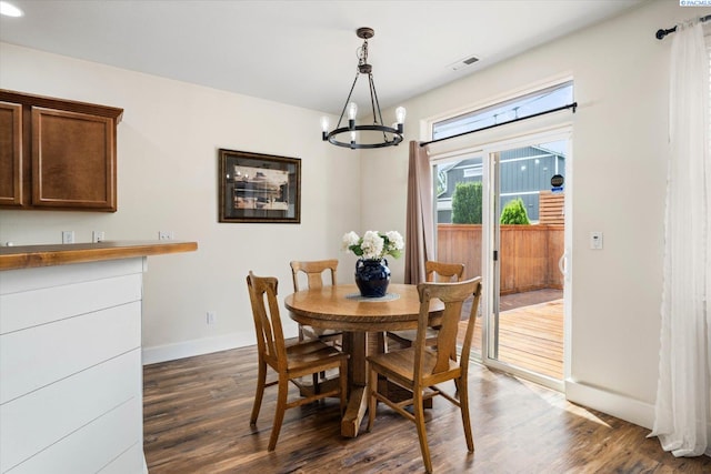 5719 W 15th Ave, Kennewick, WA 99338 - dining room with a chandelier and dark wood-type flooring