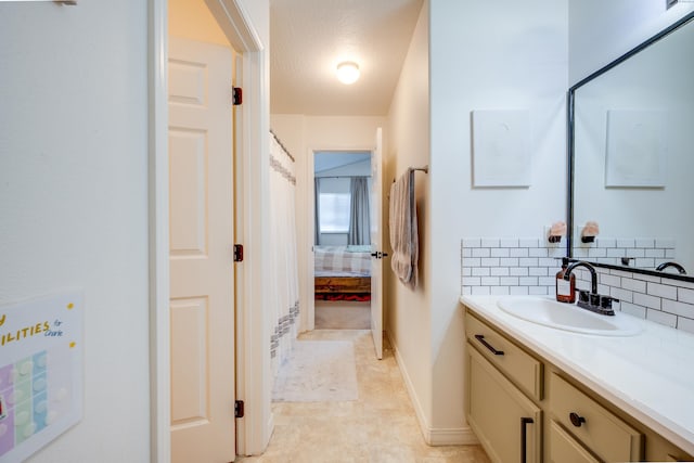 bathroom with vanity and backsplash