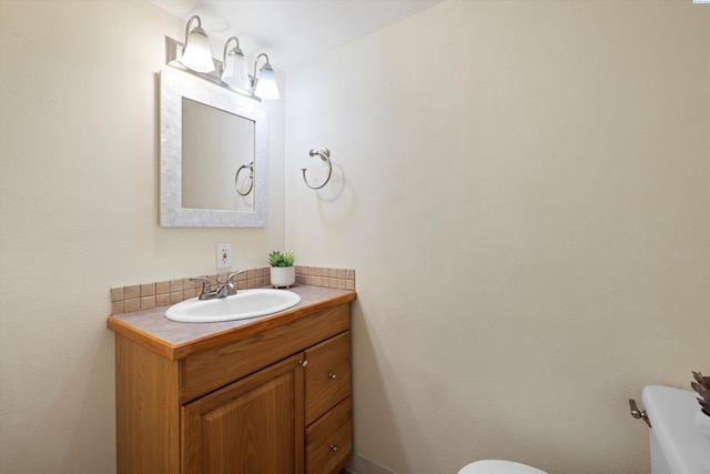 half bath with vanity and toilet