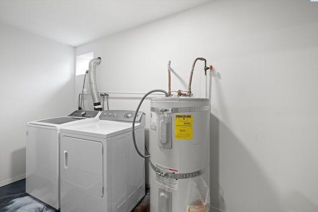 laundry room featuring secured water heater, washing machine and clothes dryer, and laundry area