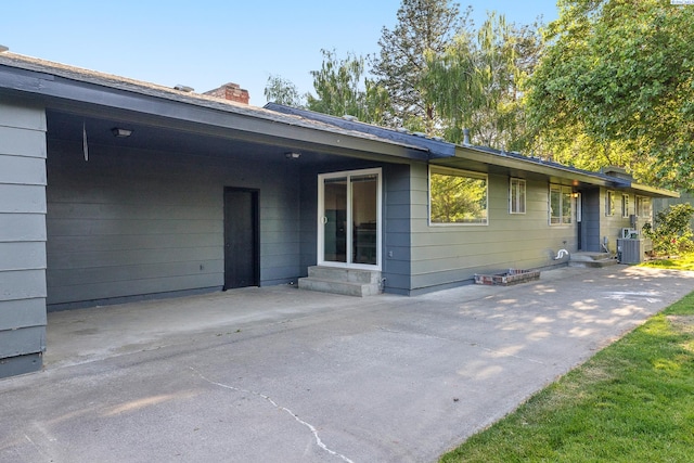 1112 Mcmurray St, Richland, WA 99354 - rear view of property with central AC, entry steps, a chimney, and a patio area