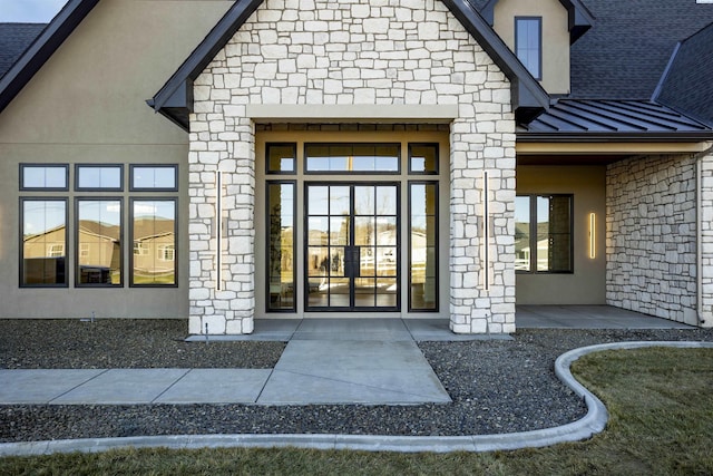 entrance to property featuring a patio area