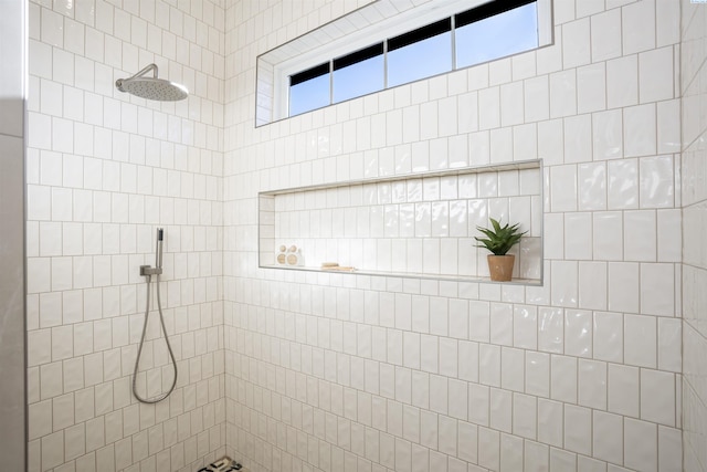 bathroom with a tile shower