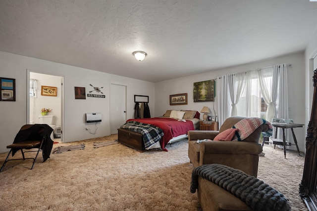bedroom with a textured ceiling and carpet floors