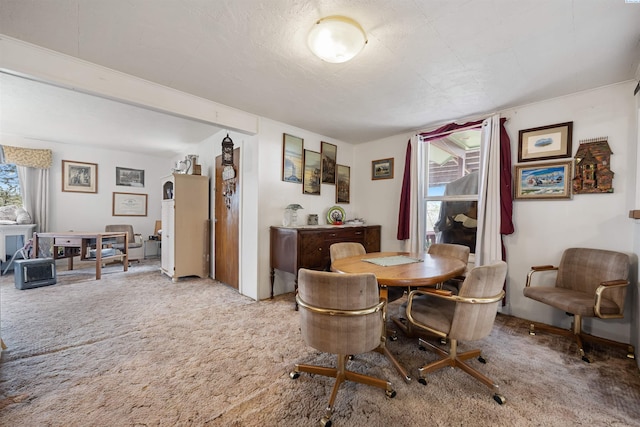 view of carpeted dining area