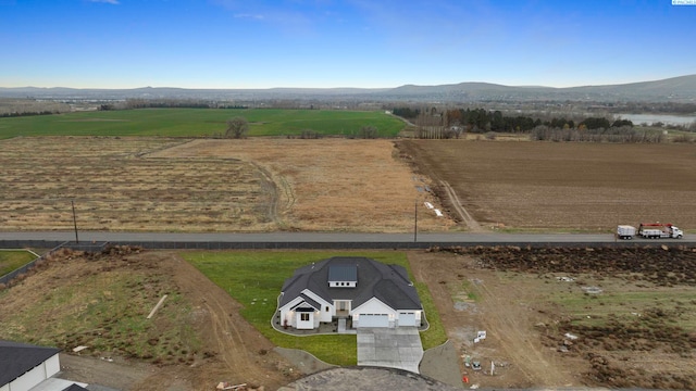 drone / aerial view with a rural view and a mountain view