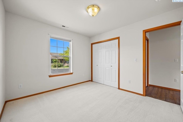 2418 S Arthur Ct, Kennewick, WA 99338 - unfurnished bedroom featuring light carpet and a closet