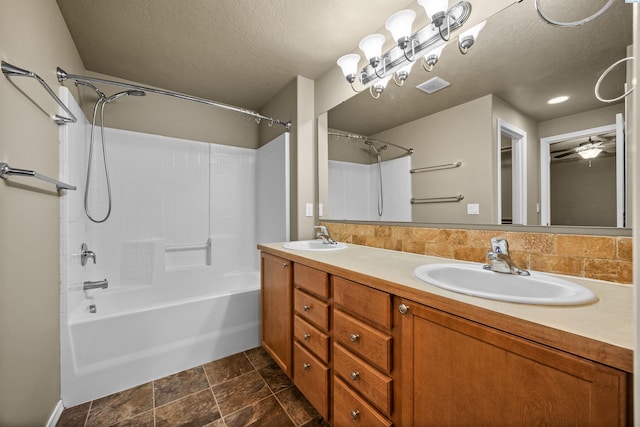 bathroom featuring vanity, backsplash, a textured ceiling, and shower / bathing tub combination