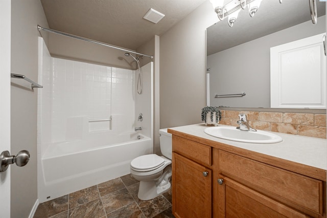 full bathroom featuring vanity, backsplash, shower / washtub combination, and toilet